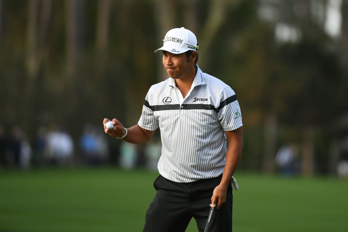 Hideki Matsuyama waves to the gallery on the 10th green during the first round of the 2020 edition of The Players Championship golf tournament at TPC Sawgrass - Stadium Course.&nbsp;