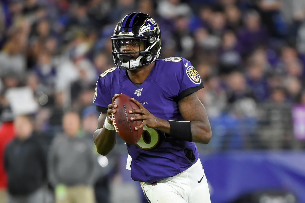 Lamar Jackson #8 of the Baltimore Ravens looks to pass against the Tennessee Titans during the AFC Divisional Playoff game at M&amp;T Bank Stadium on January 11, 2020 in Baltimore, Maryland.