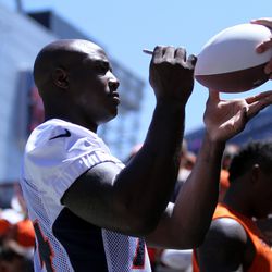 New Broncos DE DeMarcus Ware signs autographs for fans after the Summer Scrimmage