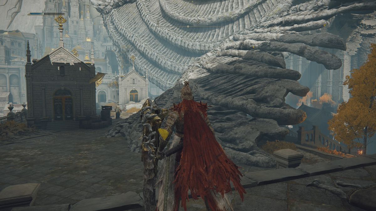 Standing next to a dragon wing in Elden Ring’s Leyndell, Royal Capital