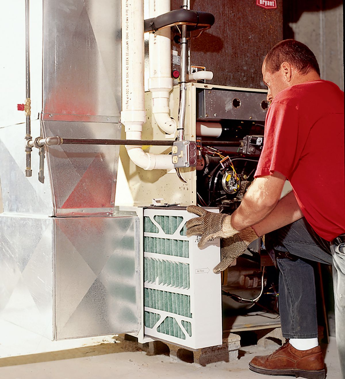 HVAC Technician Inspects AC System