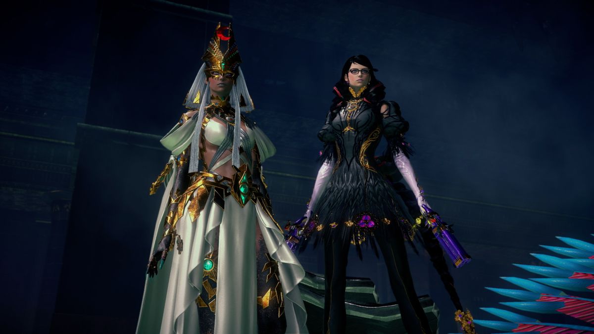A Bayonetta from another universe (left), wearing an ancient Egyptian-inspired white gown and gold jewelry, stands next to our universe’s Bayonetta (right), wearing all black