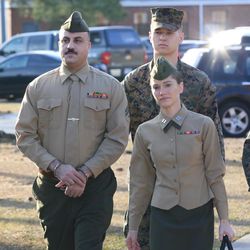 Cpl. Wassef Hassoun, left, is escorted to the courtroom on Camp Lejeune in Jacksonville, N.C., Monday, Feb. 9, 2015, for the beginning of his court martial trial. The U.S. Marine who vanished from his post in Iraq a decade ago and later wound up in Lebanon chose Monday to have his case decided by a military judge instead of a jury. Hassoun's military defense attorney Capt. Brittaney Bennett walks with him. 