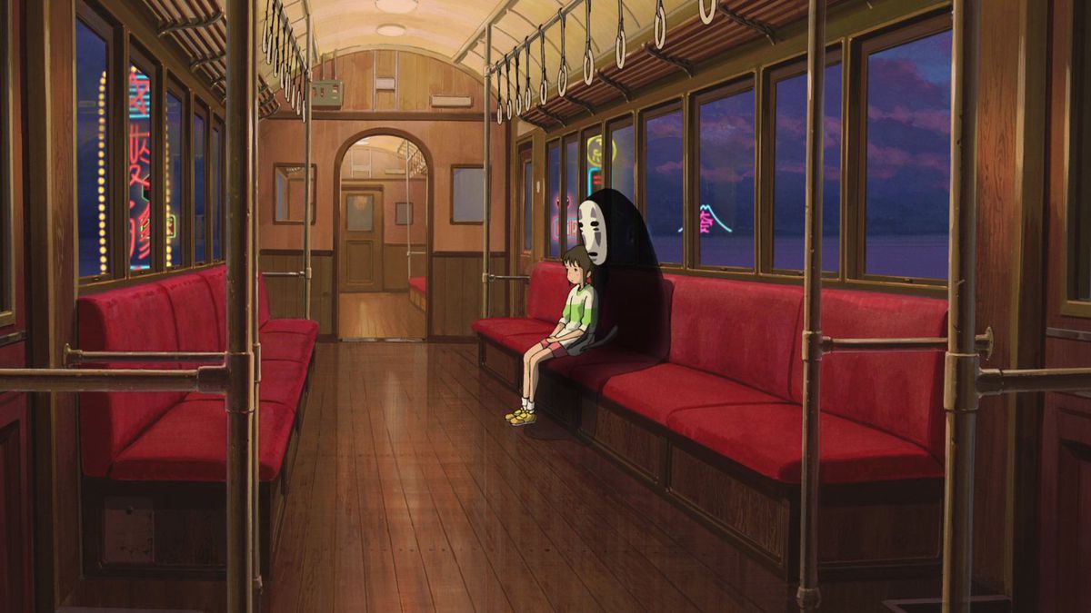 spirited away: Chihiro and No-Face sit in a train at night