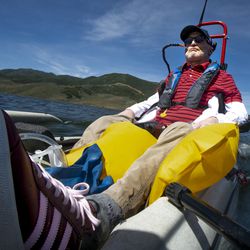 Derek Sunquist controls a sailboat with blows and sucks through a straw at East Canyon Reservoir at East Canyon State Park on Thursday, July 18, 2019. The Tetradapt Initiative offers a variety of adaptive recreation options, including a sailboat that allows quadriplegics to sail.