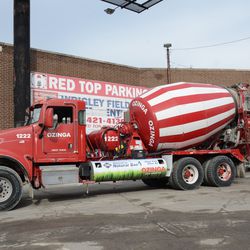 Concrete trucks staging in the parking lot, at Waveland and Clark -