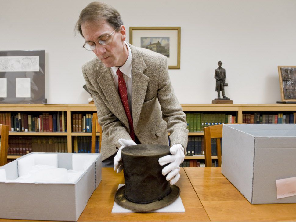 James M. Cornelius shows the Abraham Lincoln hat in 2012.