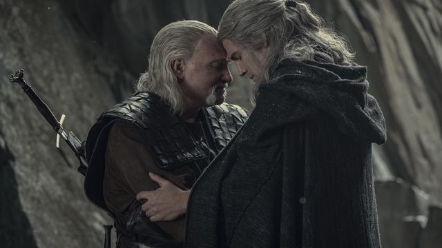 Vesemir and Geralt resting their foreheads against each other in a still from The Witcher