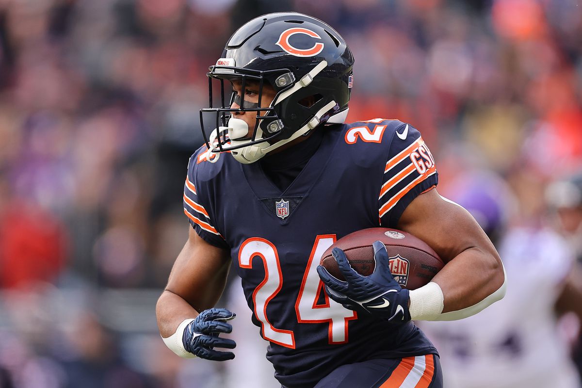 CHICAGO, ILLINOIS - JANUARY 08: Khalil Herbert #24 of the Chicago Bears runs with the ball against the Minnesota Vikings at Soldier Field on January 08, 2023 in Chicago, Illinois.