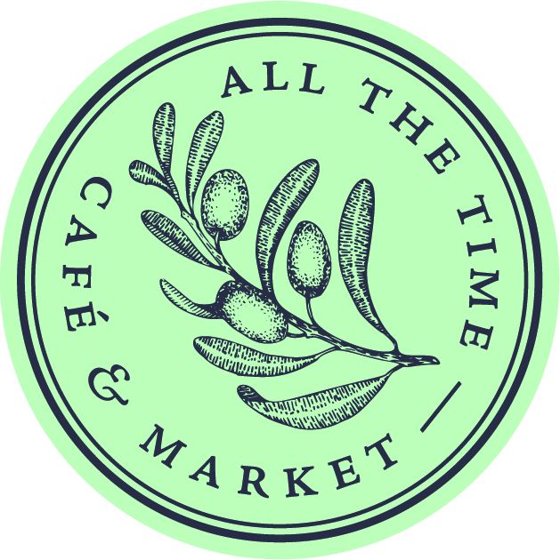 A greenish circular logo with an herb in the middle.
