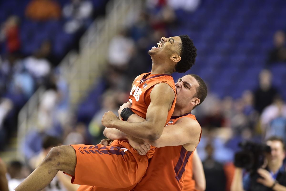 Mar 10, 2015; Greensboro, NC, USA; Virginia Tech Hokies guard Jalen Hudson (23) is lifted by Virginia Tech Hokies guard Malik Muller (1) after the game. The Hokies defeated the Demon Deacons 81-80 in the first round of the 2015 ACC Tournament.