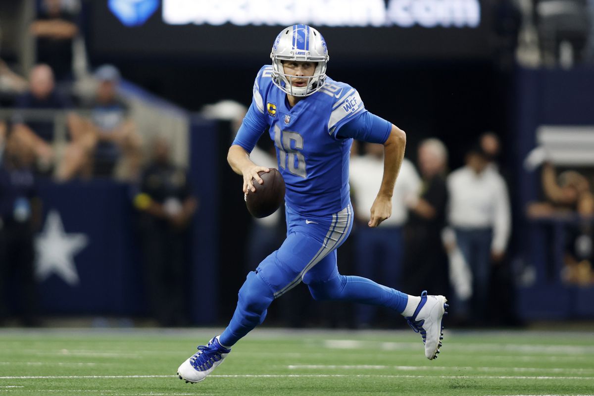 Detroit Lions quarterback Jared Goff (16) rolls out in the third quarter against the Dallas Cowboys at AT&amp;T Stadium