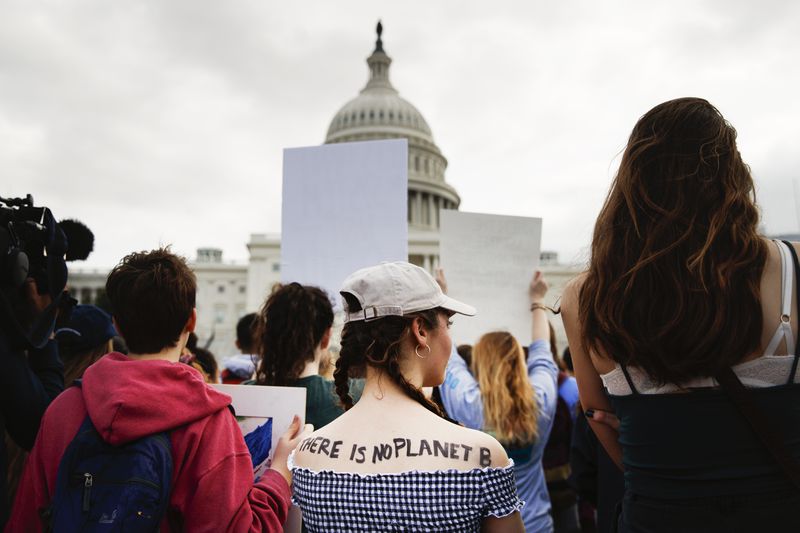 Students cheer and chant while listening to a speaker during the Youth Climate Strike on March 15, 2019 on Capitol Hill in Washington D.C.