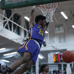 Waukegan’s Bryant Brown (25) gets a dunk in the first half against Fremd, Wednesday  03-06-19. Worsom Robinson/For the Sun-Times.