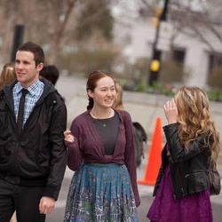 Christopher Rumsey, Tressa Barrett, and Lindsay Romney cross the street after the Sunday morning session of the 183rd Annual General Conference of The Church of Jesus Christ of Latter-Day Saints Sunday, April 7, 2013.