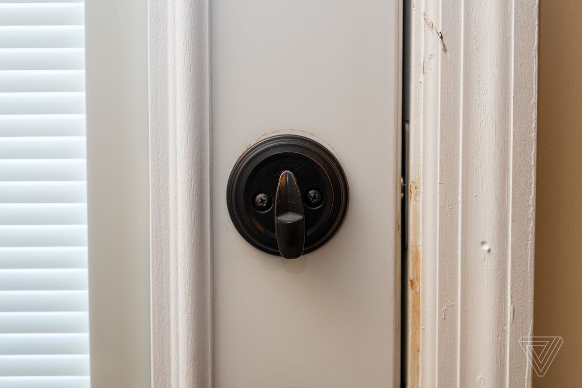 Closeup of the deadbolt lever on a closed door with the Level Lock installed