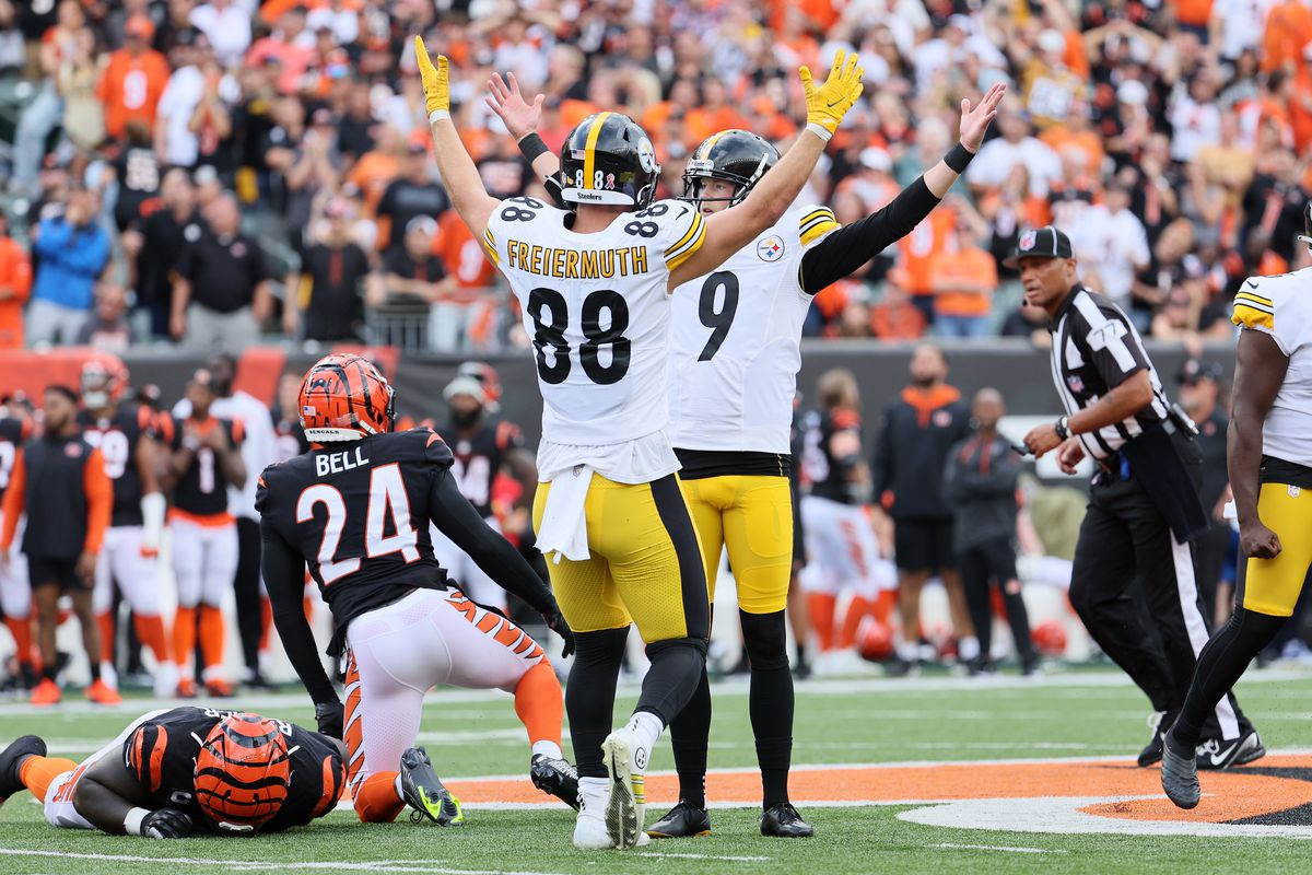 Tight end Pat Freiermuth #88 of the Pittsburgh Steelers and place kicker Chris Boswell #9 of the Pittsburgh Steelers celebrate Boswell’s game winning kick in overtime against the Cincinnati Bengals at Paul Brown Stadium on September 11, 2022 in Cincinnati, Ohio.