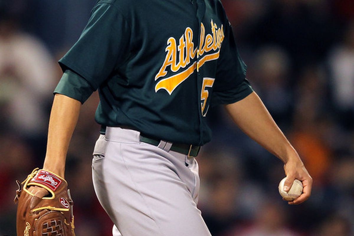 BOSTON, MA - APRIL 30:  Tommy Milone #57 of the Oakland Athletics reacts against the Boston Red Sox at Fenway Park April 30, 2012  in Boston, Massachusetts. (Photo by Jim Rogash/Getty Images)