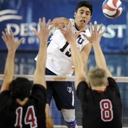 BYU's Devin Young (19) gets a kill over Stanford's Spencer Haly (14) and Stanford's James Shaw (8) during a match against the Stanford Cardinal Friday, Jan. 24, 2014, at the Smith Fieldhouse in Provo.