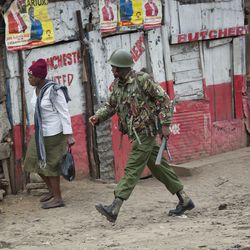 Kenyan security forces chase supporters of Kenyan opposition leader and presidential candidate Raila Odinga who demonstrate in the Mathare area of Nairobi Wednesday, Aug. 9, 2017. Odinga alleges that hackers manipulated the Tuesday election results which appear to show President Uhuru Kenyatta has a wide lead over Odinga. (AP Photo/Jerome Delay)