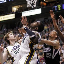 Gordon Hayward, left, and Paul Millsap, of Utah, along with Francisco Garcia of Sacramento, look for a rebound as the Sacramento Kings face the Utah Jazz in NBA basketball in Salt Lake City, Friday, March 30, 2012.