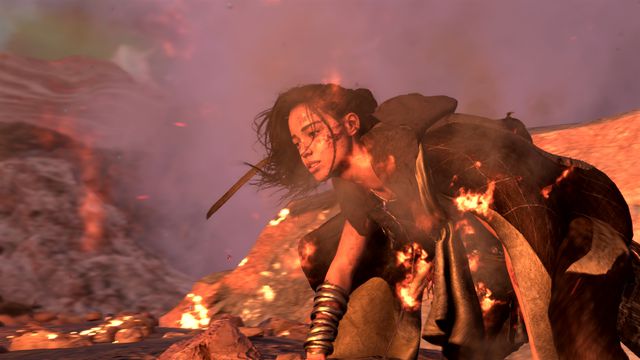 An image of Frey from Forspoken after a battle. She’s picking herself off the ground and she has cuts and bruises on her after a fight. 