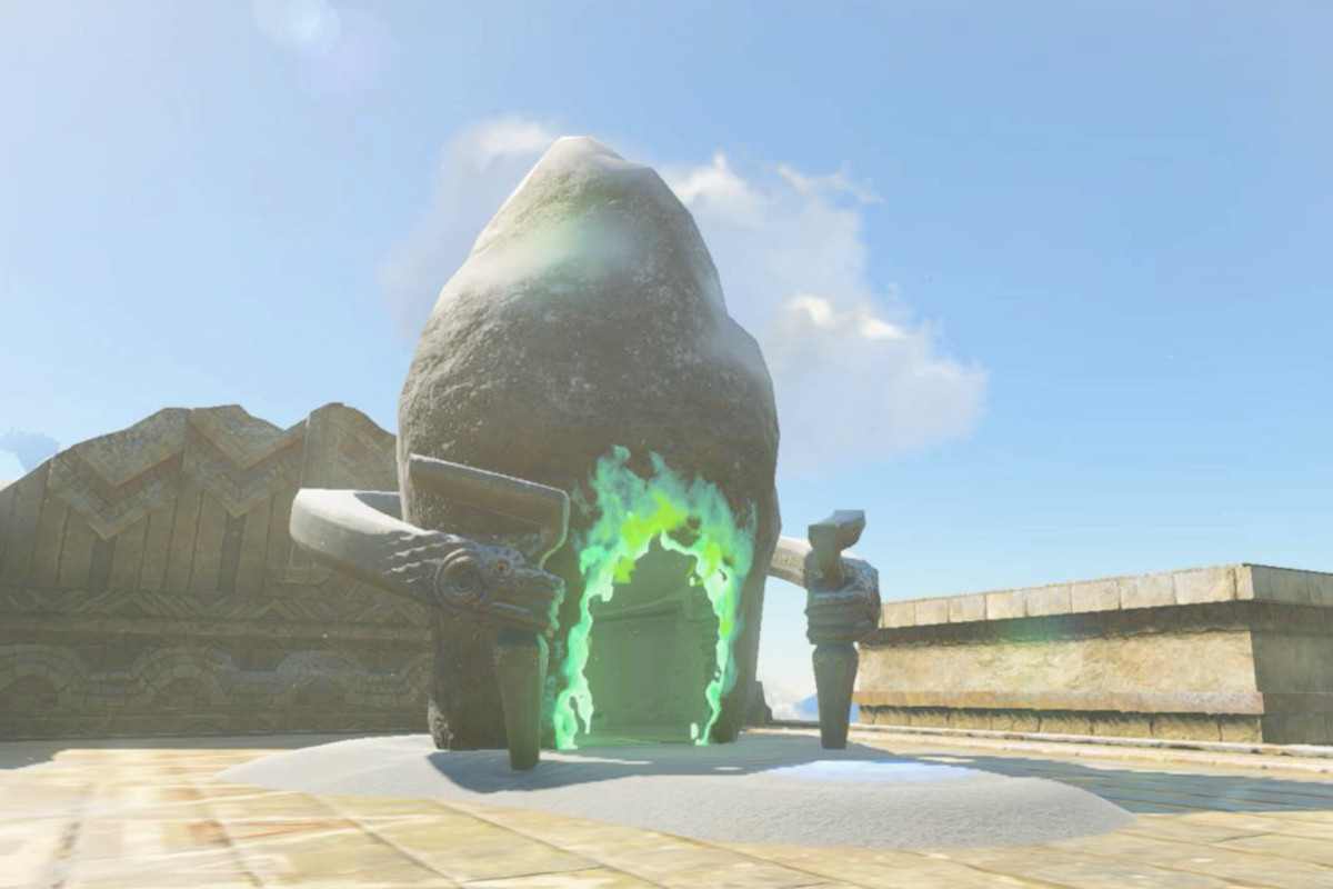 An image of the outside of the Mayaumekis Shrine  in The Legend of Zelda: Breath of the Wild. It looks like a rock with a glowing green portal that leads to another place.
