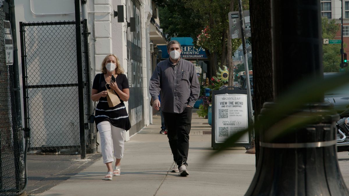 Reporters Stephanie Zimmermann and Tom Schuba leaving the Zen Leaf dispensary in Greektown with their purchase.