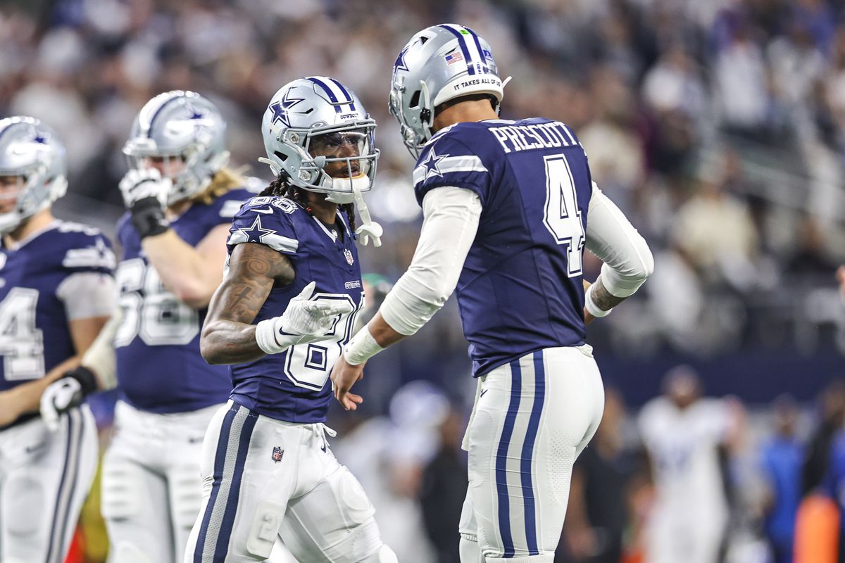 Dallas Cowboys wide receiver CeeDee Lamb (88) celebrates with quarterback Dak Prescott (4) after catching a pass for a touchdown during the game between the Dallas Cowboys and the Detroit Lions on December 30, 2023 at AT&amp;T Stadium in Arlington, Texas.