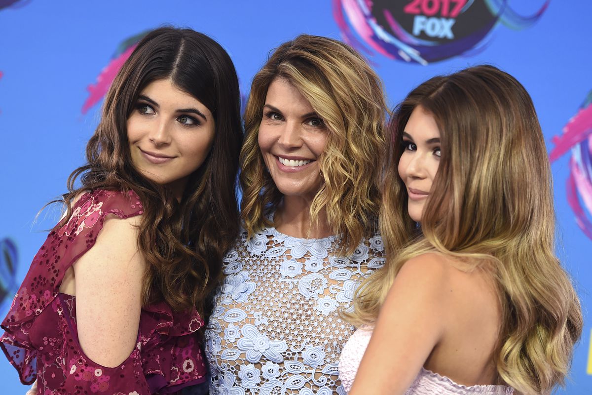 Bella Loughlin, from left, Lori Loughlin, and Olivia Loughlin arrive at the Teen Choice Awards at the Galen Center on Sunday, Aug. 13, 2017, in Los Angeles.