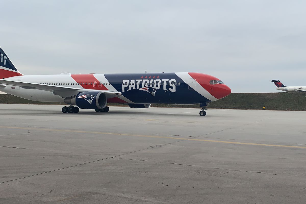New England Patriots Arrive To Super Bowl In Custom Plane
