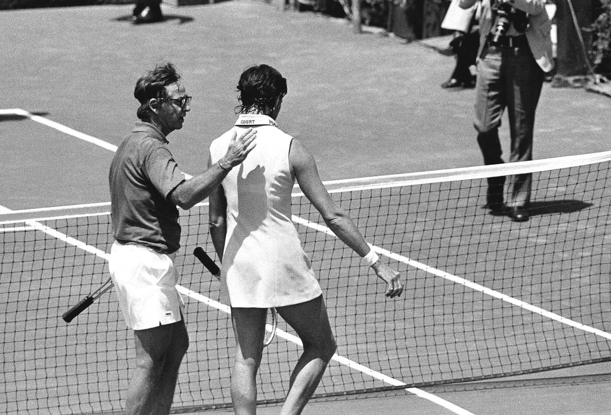 Australia’s Margaret Court, 30, rated the world’s No. 1 woman tennis player, gets a pat on the back from Bobby Riggs, 55, after he easily defeated her in their celebrated match game at Ramona, Calif., May 13, 1973. Riggs, former world’s men’s champion, won with an assortment of his “junk” shots.
