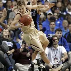Elon's Steven Santa Ana (22) is tripped by Duke's Grayson Allen (3) in the first half of an NCAA college basketball game in Greensboro, N.C., Wednesday, Dec. 21, 2016. Allen was called for a technical foul on the play. 