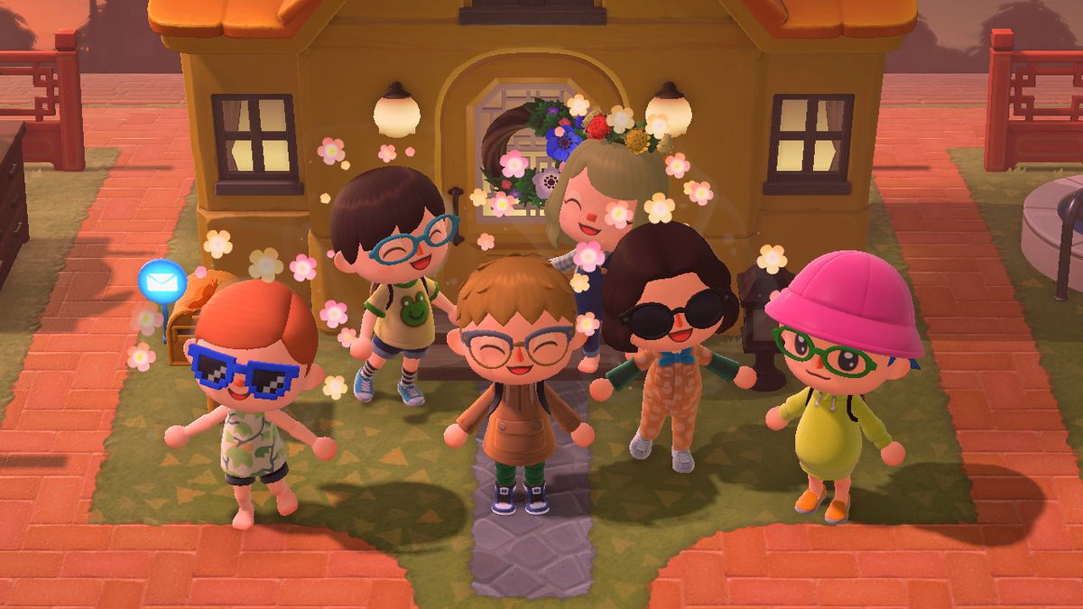 A group of Polygon Animal Crossing players standing in front of a hoise