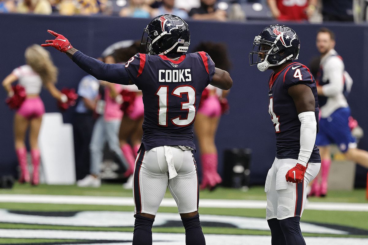 Brandin Cooks #13 of the Houston Texans celebrates a touchdown with Phillip Dorsett #4 against the Los Angeles Chargers at NRG Stadium on October 02, 2022 in Houston, Texas.