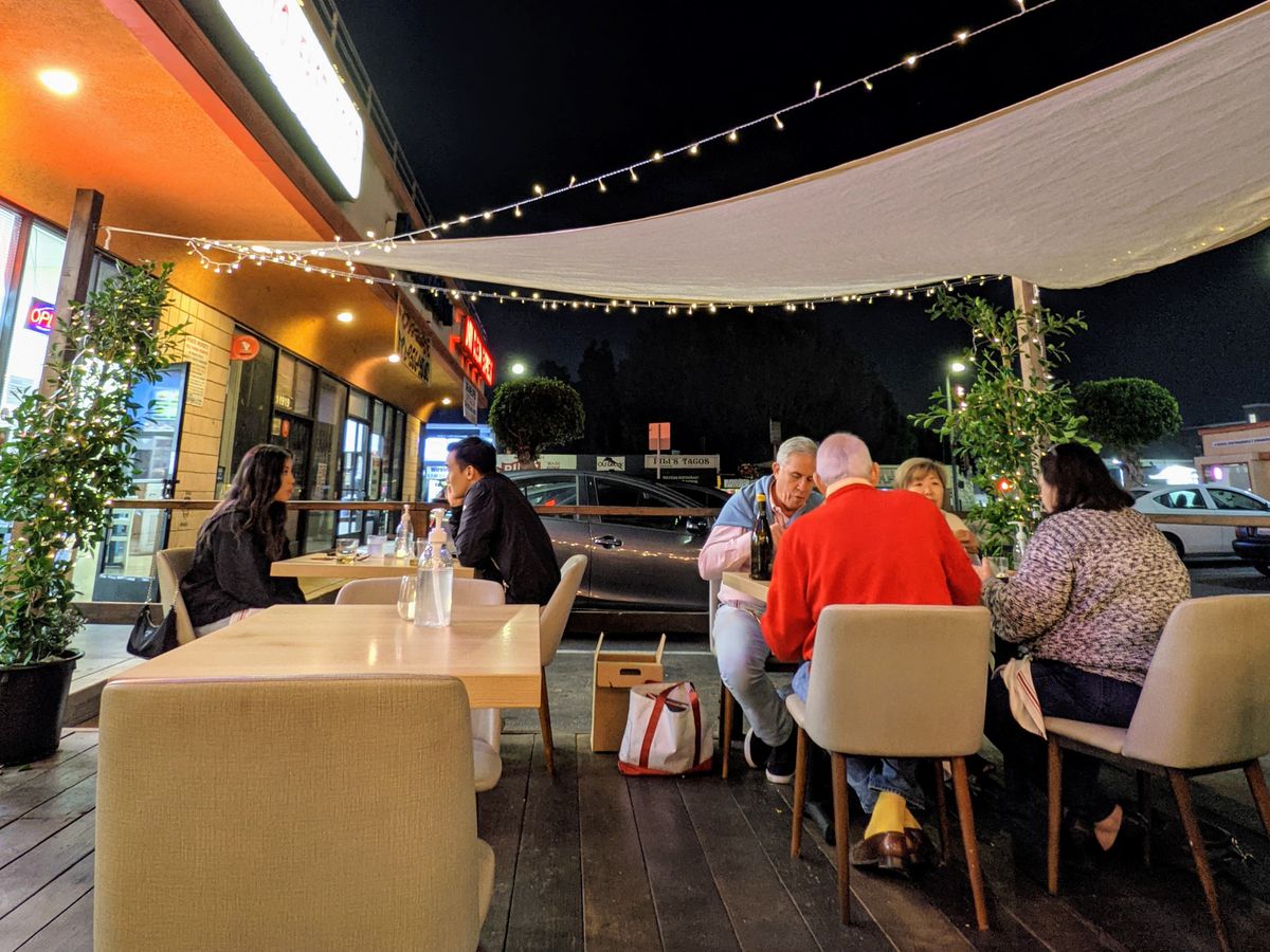 Outdoor dining patio at Kato in West Los Angeles, California.