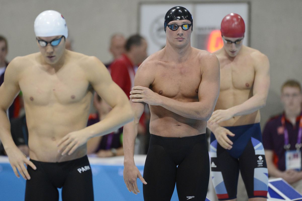 Jul 30, 2012; London, United Kingdom; Ryan Lochte (USA), middle, prepares to compete in the men's 200m freestyle finals during the London 2012 Olympic Games at Aquatics Centre. Mandatory Credit: Richard Mackson-USA TODAY Sports