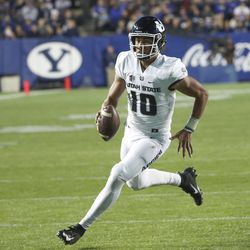 Utah State Aggies quarterback Jordan Love (10) sprints out of the pocket for a big gain during the Utah State versus BYU football game at LaVell Edwards Stadium in Provo on Friday, Oct. 5, 2018.