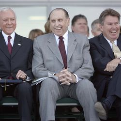 President Thomas S. Monson, president of The Church of Jesus Christ of Latter-day Saints, laughs along with U.S. Sen. Orrin Hatch, left, and Rep. Greg J. Curtis, speaker of the Utah House of Representatives, after a comment by Utah Valley University President William Sederburg. President Monson offered the dedicatory prayer for the new UVU library.
