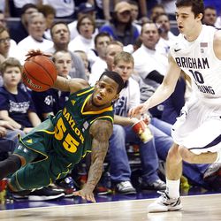 Baylor's #55 Pierre Jackson ,left, falls to the floor as he tries to turn the corner with BYU's #10 Matt Carlino defending as BYU and Baylor play Saturday, Dec. 17, 2011 in the Marriott Center in Provo. Baylor won 86-83.