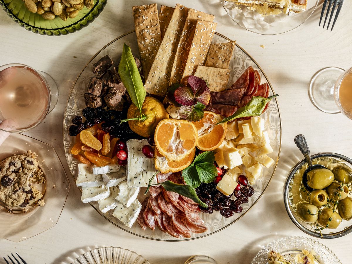 spread of meats, cheeses, desserts, and fruits