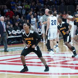 Providence St. Mel’s Tim Ervin ll (2), Corey Brooks (20), Jordan Green (5) rush the court after winning the 1A state championship, Saturday 03-09-19. Worsom Robinson/For the Sun-Times.