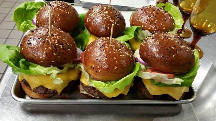 A trayful of new cheeseburgers at Juniper Commons.