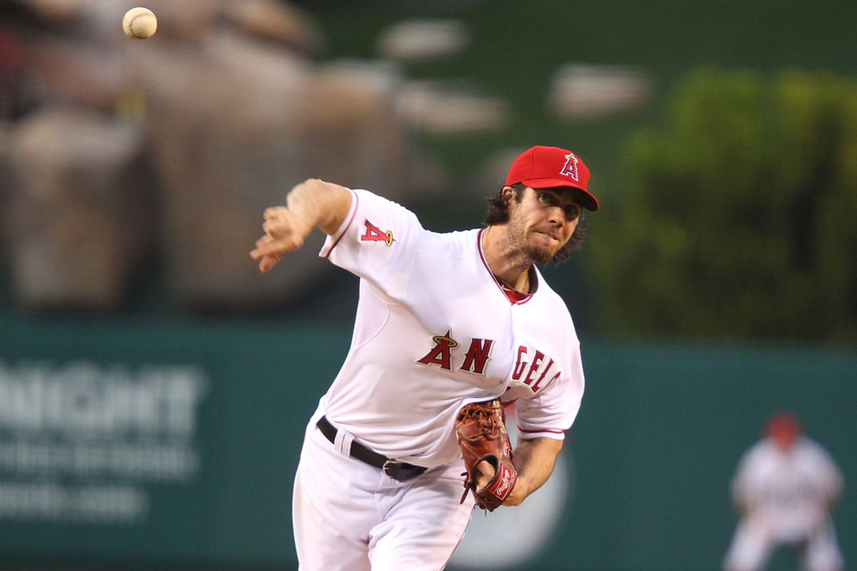 ANAHEIM, CA - MAY 24:  Dan Haren #24 of the Los Angeles Angels of Anaheim pitches in the first inning against the Oakland Athletics during the game at Angel Stadium on May 24, 2011 in Anaheim, California.  (Photo by Joe Scarnici/Getty Images)