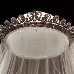 LONDON - JULY 20:  ()   The Cartier "Halo" tiara, worn by the Duchess of Cambridge on her wedding day is photographed before it goes on display at Buckingham Palace during the annual summer opening on July 20, 2011 in London, England. The tiara,