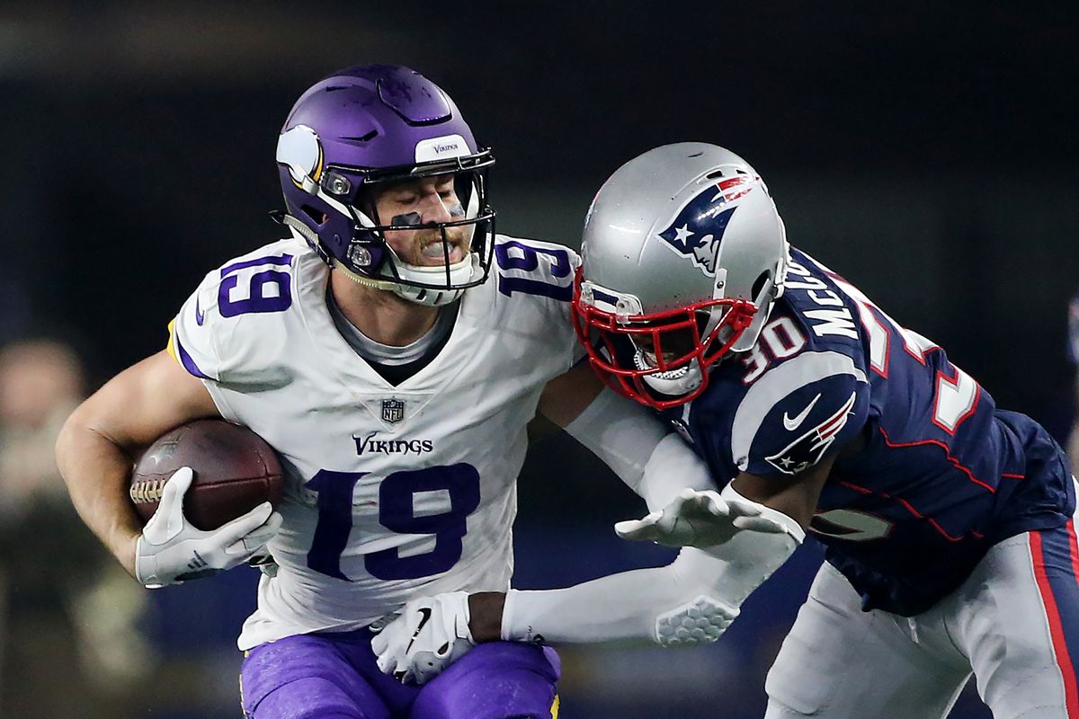 FOXBORO, MA. - DECEMBER 2: Adam Thielen of the Minnesota Vikings is stopped by Jason McCourty of the New England Patriots during the fourth quarter of the game at Gillette Stadium on December 2, 2018 in Foxboro, Massachusetts. (Staff Photo By Nancy Lane/