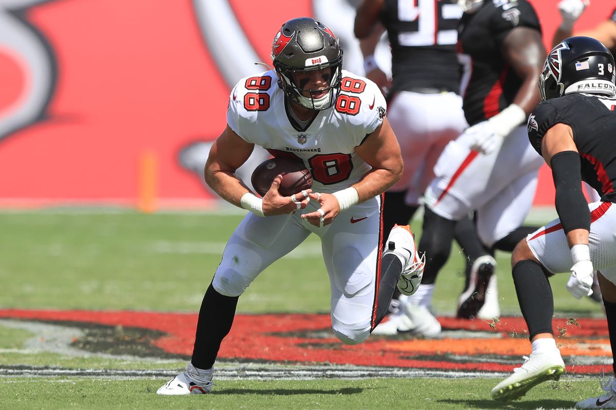 TAMPA, FL - OCTOBER 22: Tampa Bay Buccaneers Tight End Cade Otton (88) fights for yardage after making a catch during the regular season game between the Atlanta Falcons and the Tampa Bay Buccaneers on October 22, 2023 at Raymond James Stadium in Tampa, Florida.