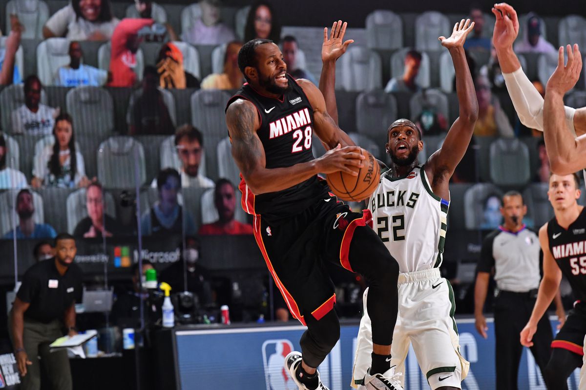 Andre Iguodala of the Miami Heat passes the ball against the Milwaukee Bucks on August 6, 2020 at The Arena at ESPN Wide World of Sports in Orlando, Florida.&nbsp;
