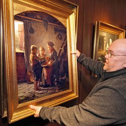 Soren Edsberg admires "Mealtime at Grandma's" as 17 original oil paintings by famed artist Carl Bloch are returned by museums in Denmark to the Hope Gallery in Salt Lake after a hugely successful exhibition of his works there Thursday, Feb. 28, 2013, in Salt Lake City.