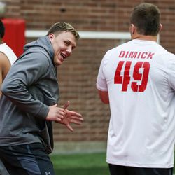 Offensive tackle Garett Bolles jokes around with defensive end Hunter Dimick at the University of Utah football Pro Day in Salt Lake City on Thursday, March 23, 2017.